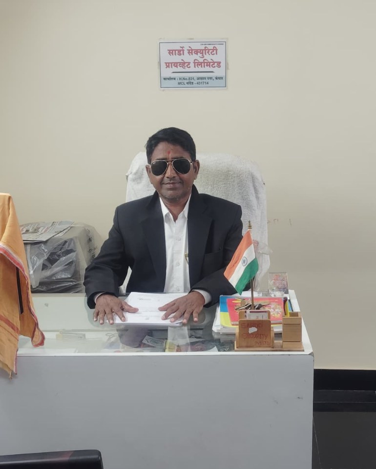 Managing Director Mr. R.R. Shinde at Sardo Security administration office desk in Nanded